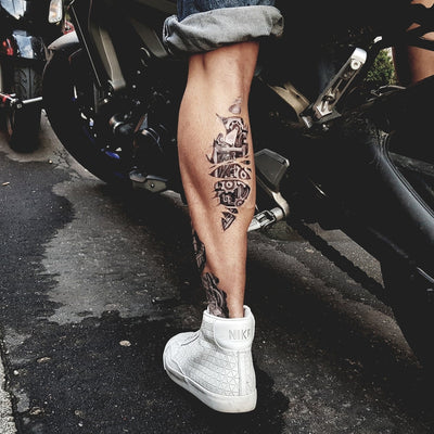 Tatouage temporaire hyperréaliste Biomechanical 2 - White Touch de ArtWear Tattoo Cartoon sur le bras d'un homme et jambe d'une femme