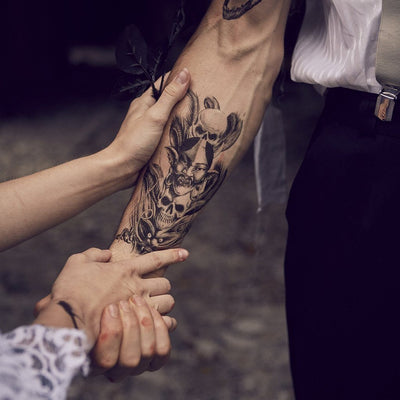 Tatouage temporaire hyperréaliste Evils Heads de ArtWear Tattoo Divers Fantaisie sur le bras d'un homme et jambe d'une femme
