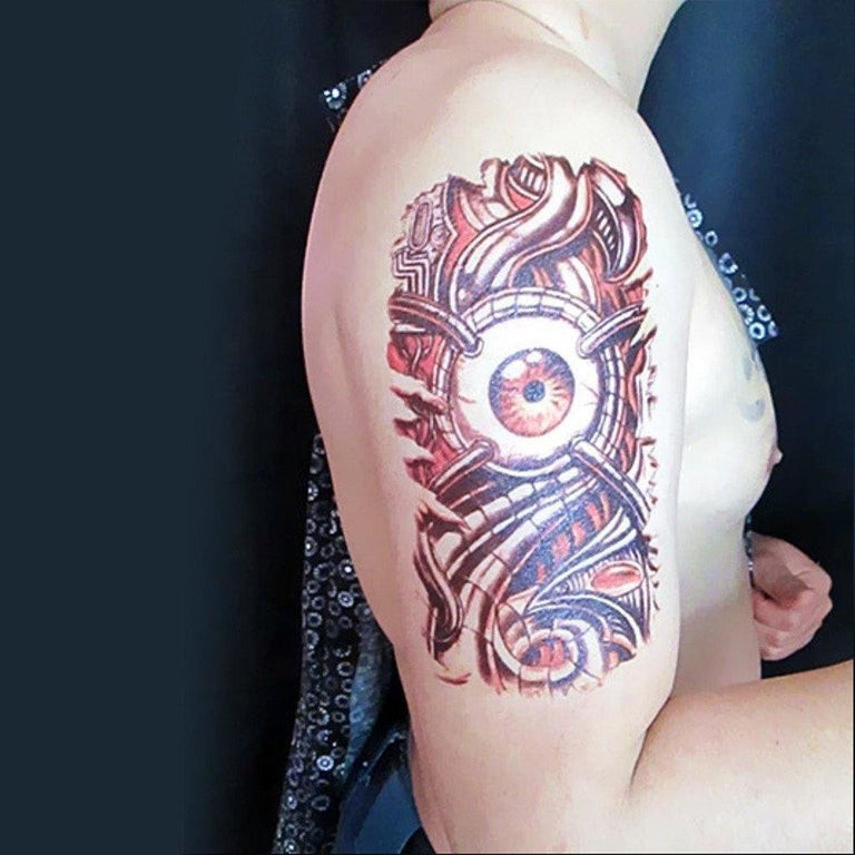 Tatouage temporaire hyperréaliste Mechanical Eye de ArtWear Tattoo Divers Fantaisie sur le bras d'un homme et jambe d'une femme