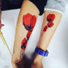 Tatouage temporaire hyperréaliste Poppies de ArtWear Tattoo Fleurs sur le bras d'un homme et jambe d'une femme
