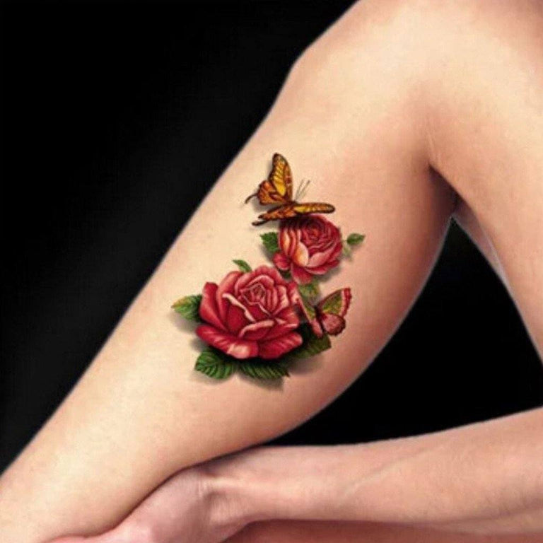 Tatouage temporaire hyperréaliste Roses & Butterflies de ArtWear Tattoo Fleurs sur le bras d'un homme et jambe d'une femme