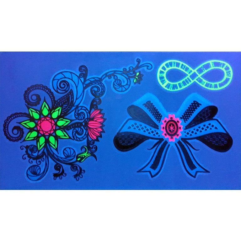 Tatouage temporaire hyperréaliste Ultraviolet Bow & Flower Pack de ArtWear Tattoo Fluorescents & Phosphorescents sur le bras d'un homme et jambe d'une femme