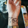 Tatouage temporaire hyperréaliste World Map de ArtWear Tattoo Géométriques sur le bras d'un homme et jambe d'une femme