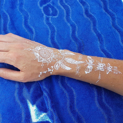 Tatouage temporaire hyperréaliste White Collection - Dreamcatcher, Birds & Butterflies - Pack de ArtWear Tattoo Mandala sur le bras d'un homme et jambe d'une femme