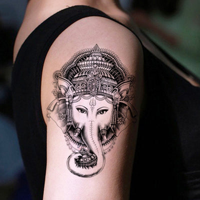 Tatouage temporaire hyperréaliste Elephant God Ganesha de ArtWear Tattoo Religieux sur le bras d'un homme et jambe d'une femme