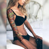 Tatouage temporaire hyperréaliste Alice Sleeve de ArtWear Tattoo Sleeve sur le bras d'un homme et jambe d'une femme